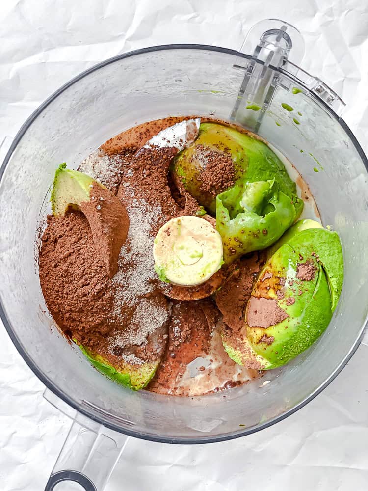 ingredients for avocado mousse in a food processor.
