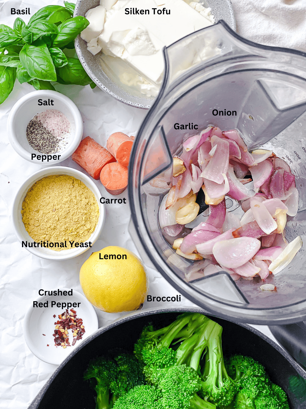 ingredients for Broccoli Pasta Sauce measured out on a white surface