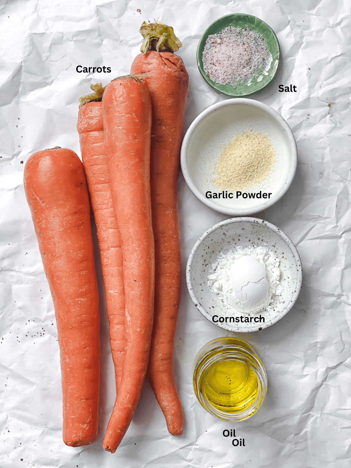 ingredients for Carrot Fries measured out on a white surface