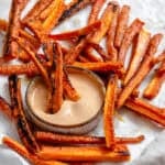 completed Carrot Fries scattered on a white surface