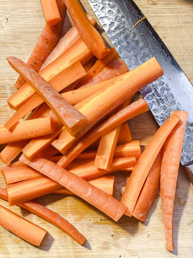 process shot showing slicing carrots