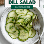 pinterest image of cucumber dill salad in a white bowl with a fork.