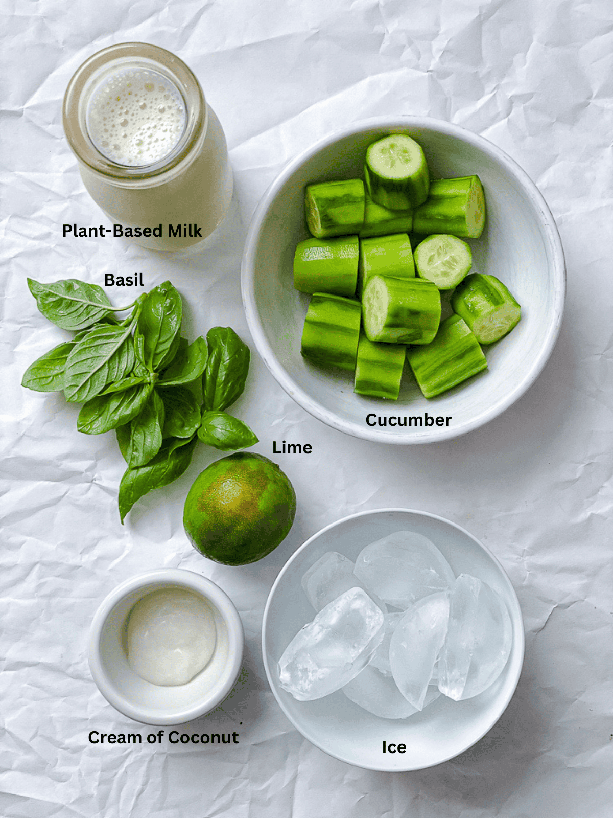 ingredients for Cucumber Smoothie measured out on a white surface