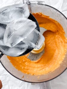 process shot showing adding ice to food processor