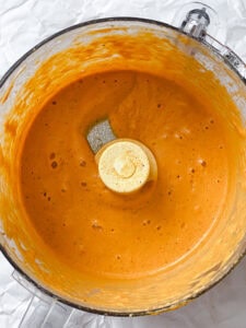 process shot showing post processed ingredients in foor processor