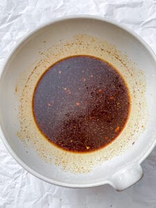 process shot showing sauce for Crispy Brussel Sprouts in bowl
