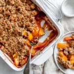 completed Easy Vegan Peach Cobbler in baking dish