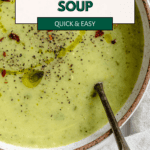 pinterest image of zucchini soup in a white bowl.