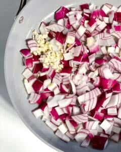 process shot showing onions cooking in pan