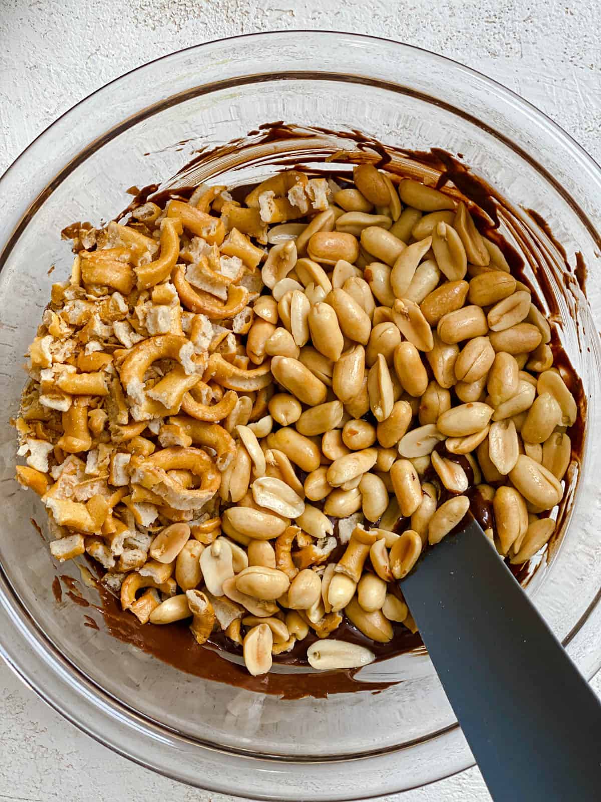 process shot showing mixing in peanuts into bowl