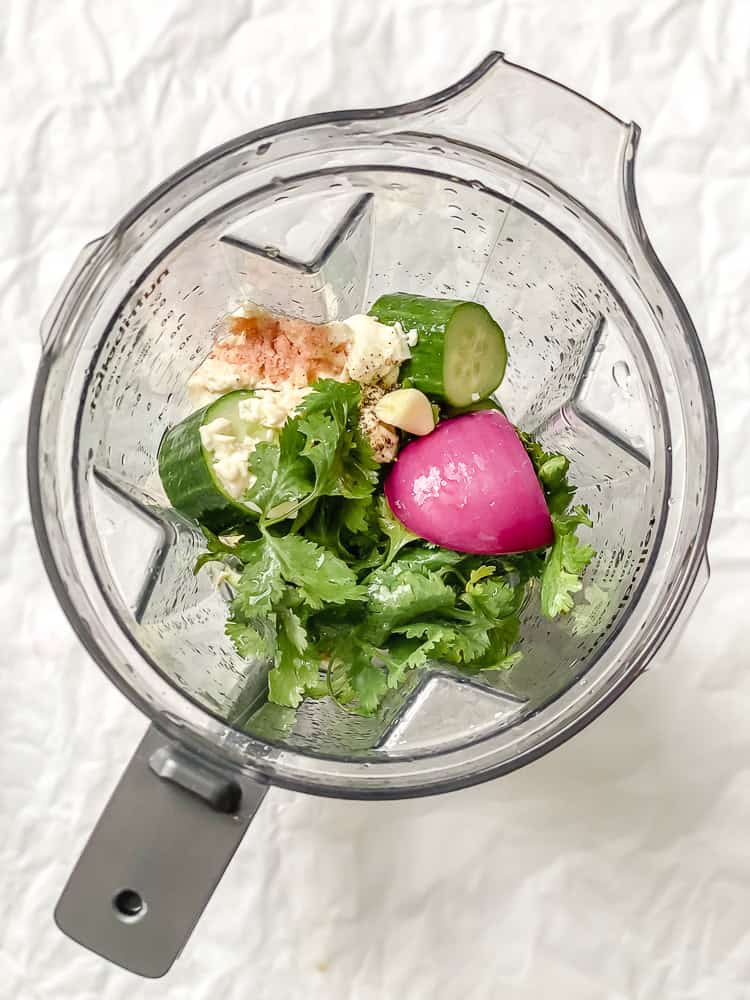process shot showing ingredients in a blender