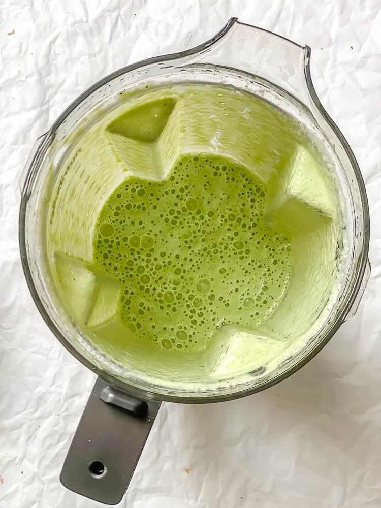 process shot showing blended ingredients in blender