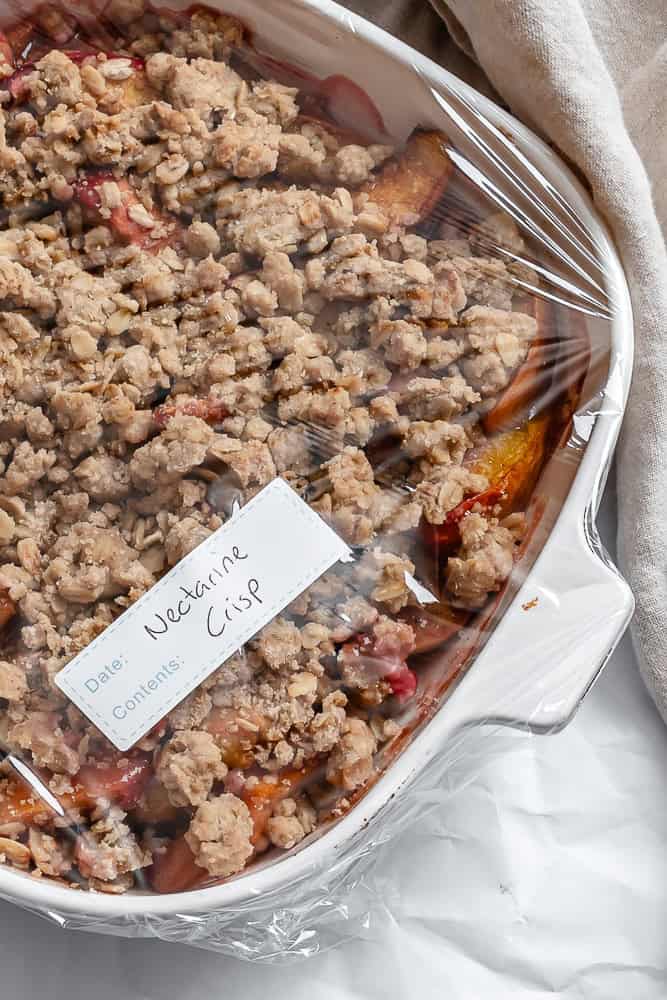 completed Easy Nectarine Crisp in a storage container