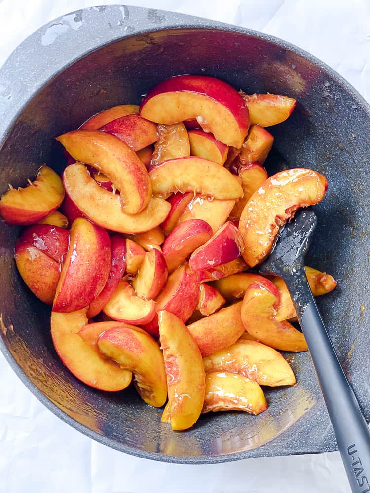 process shot showing mixing nectarines with filling ingredients