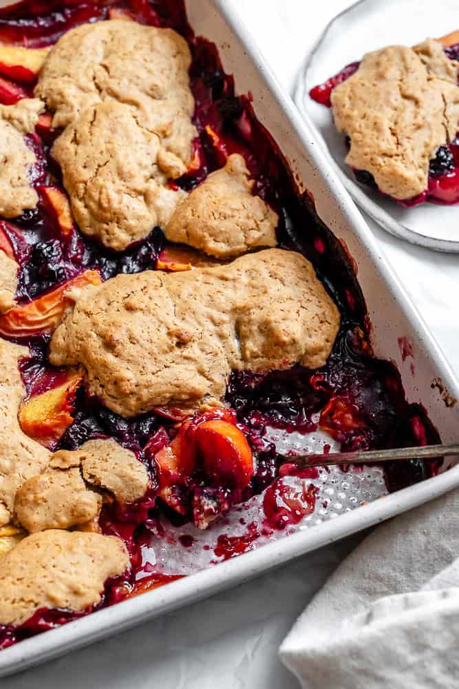 completed Peach and Blueberry Cobbler in baking dish