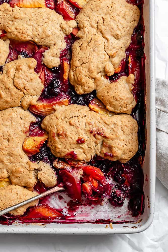 completed Peach and Blueberry Cobbler in baking dish