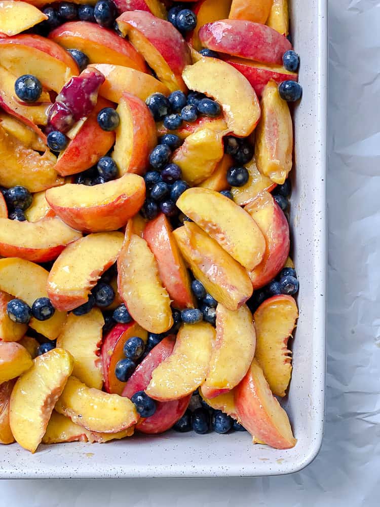 process shot showing fruit mixture in baking pan