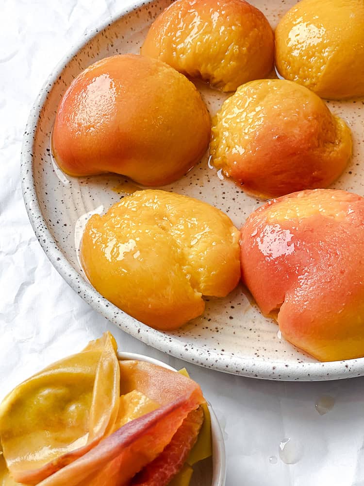 poached peaches on a plate.