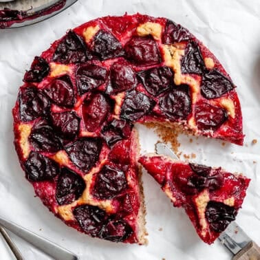 completed Easy Plum Cake on a white surface