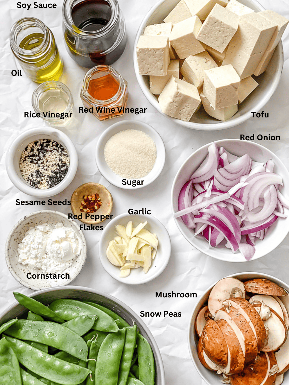 ingredients for Stir-Fried Veggies With Tofu on a white surface