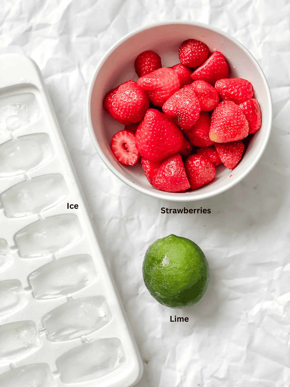 ingredients for Easy Strawberry Slushie Recipe measured out on a white surface