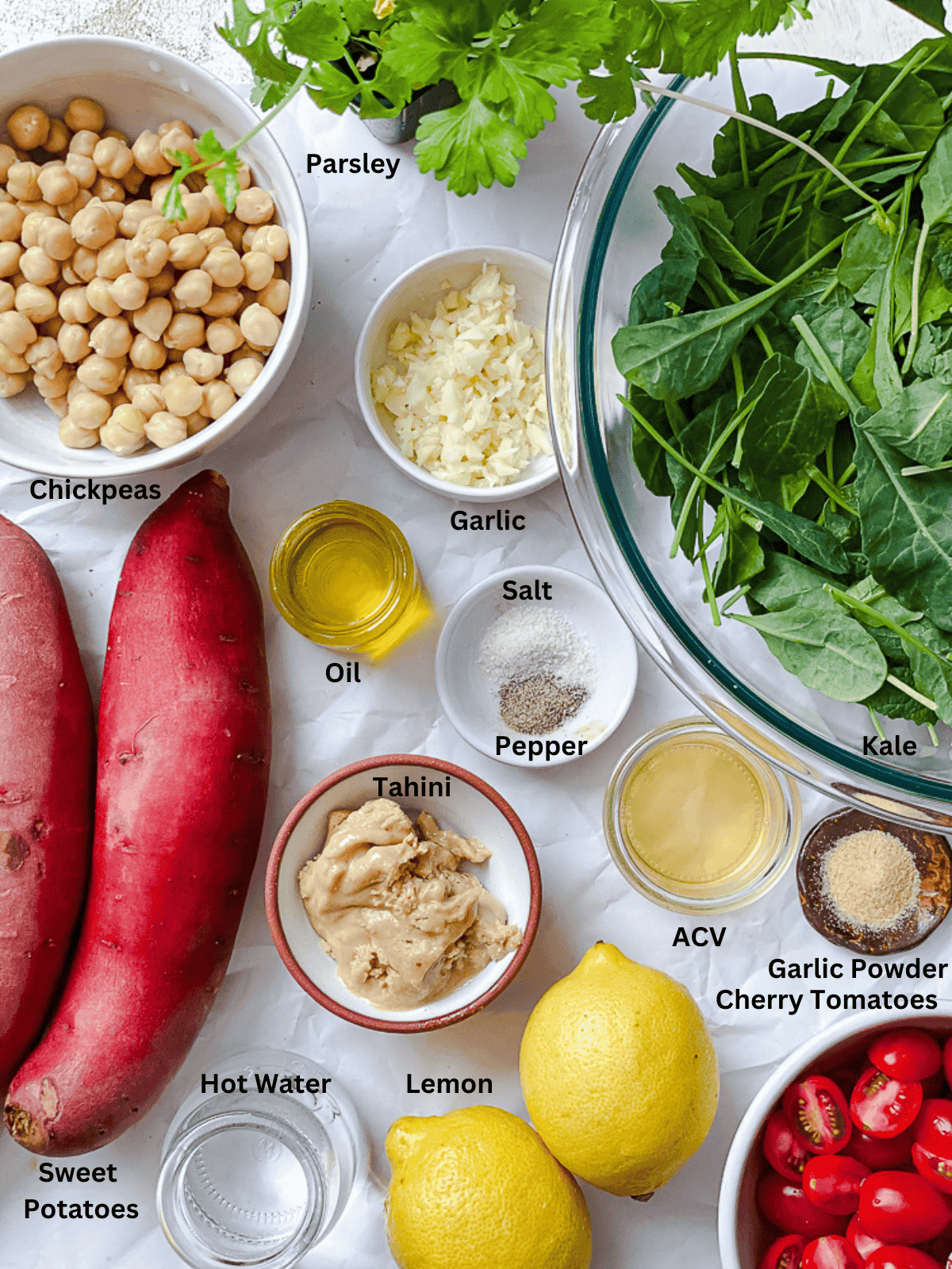 ingredients for Sweet Potato and Kale Salad measured out on a white surface