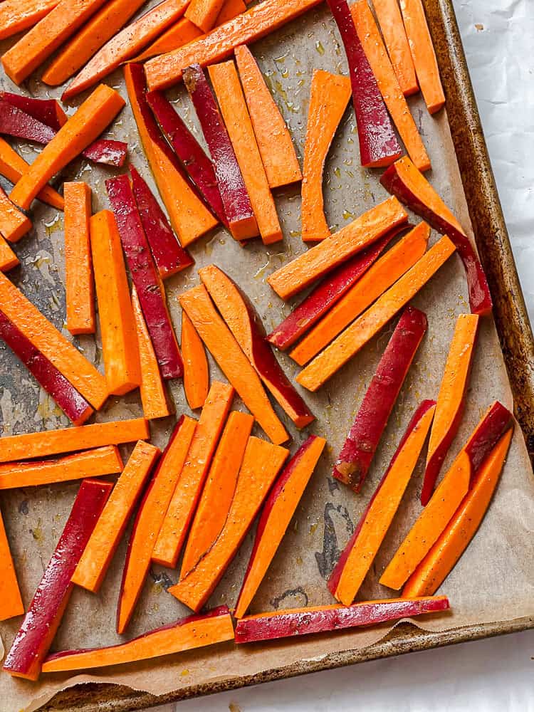 process shot showing sweet potatoes on baking tray