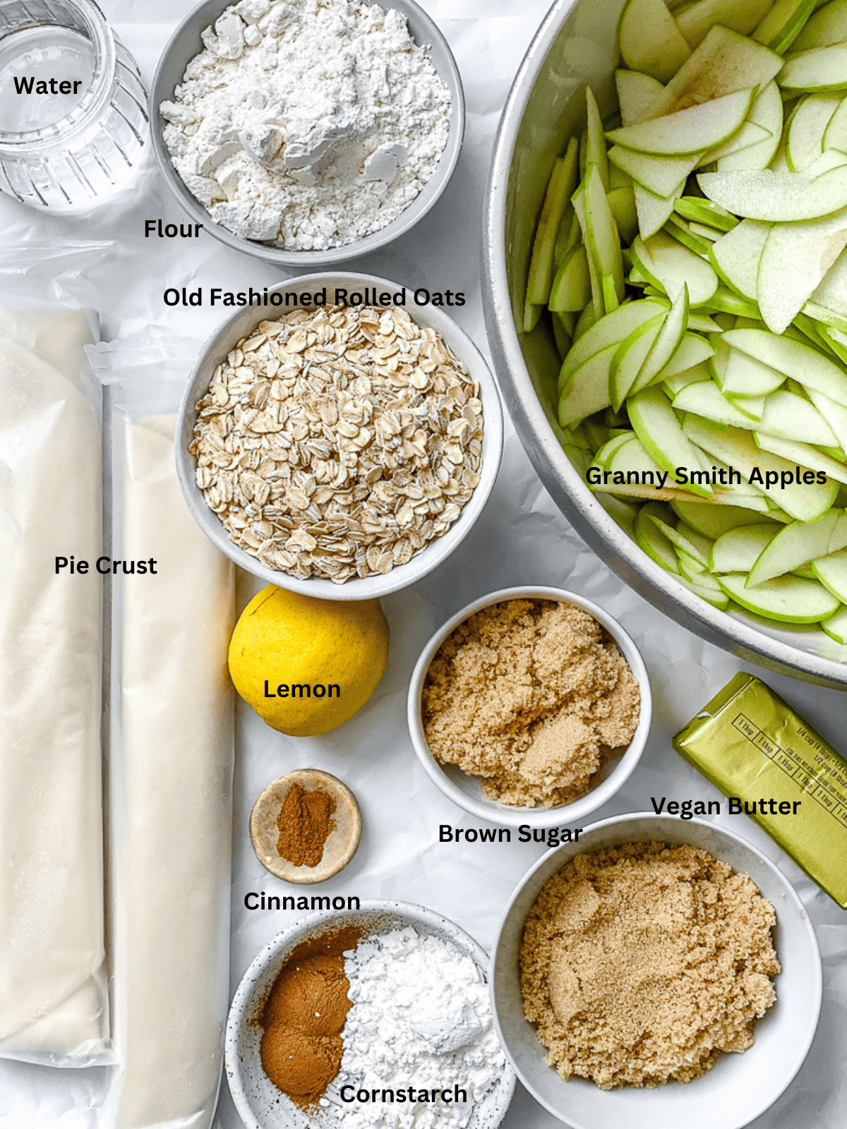 ingredients for Easy Apple Pie Bars measured out on a white surface