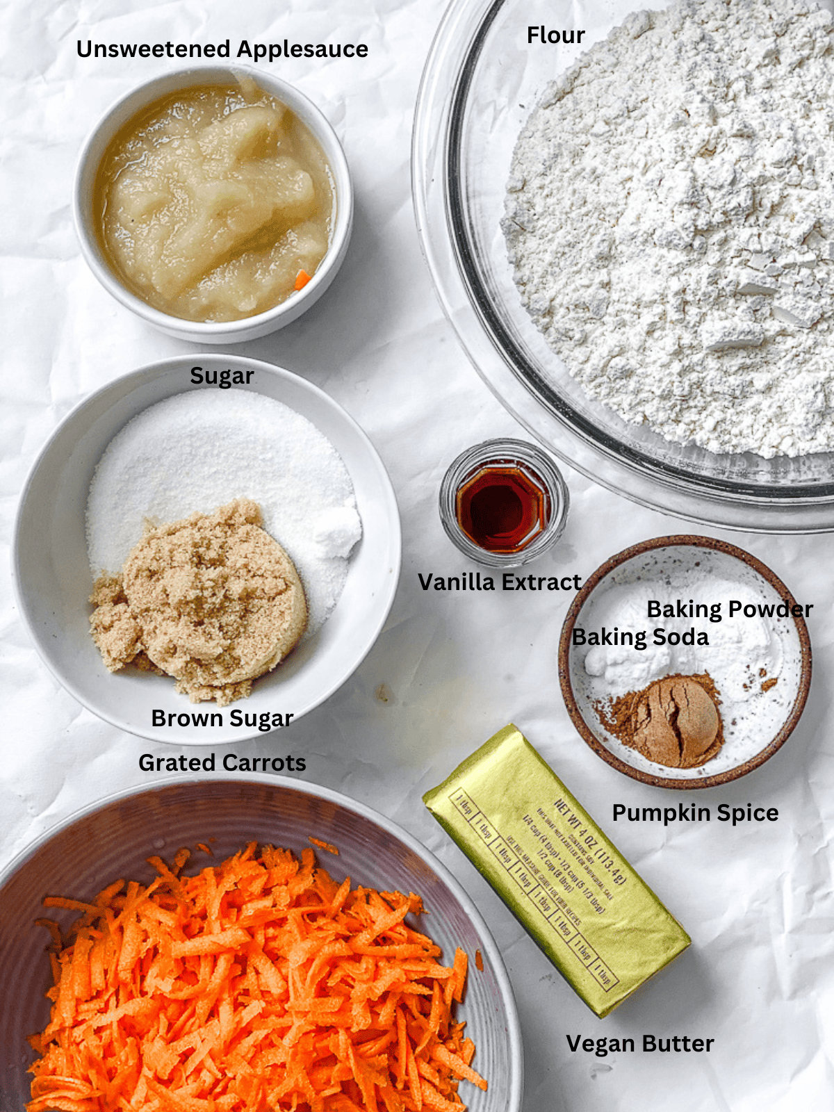 ingredients for Carrot Cake Cookies (Vegan) measured out on a white surface