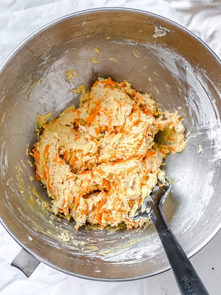 process shot of mixing ingredients together in a bowl