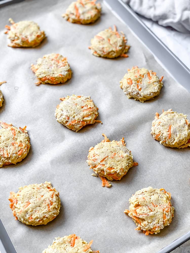 process shot showing carrot cake cookies pre-baked on baking sheet