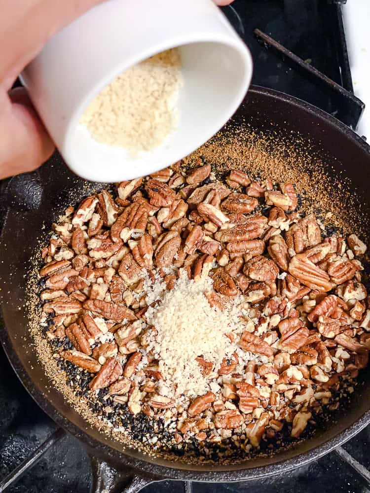 process shot showing spices being added to pan