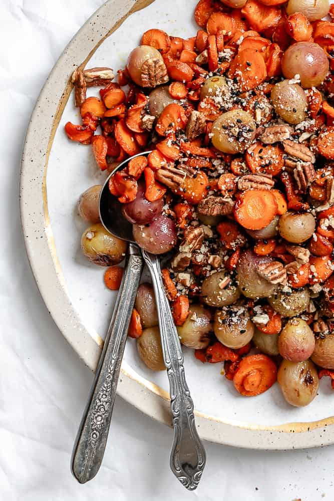 completed carrot grape side dish on white plate