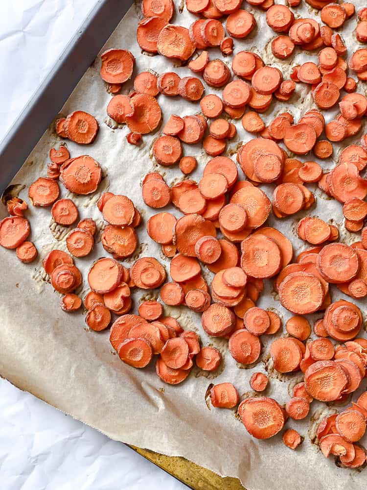 process shot showing carrots on baking dish