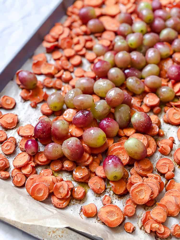 process shot showing grapes added to baking dish