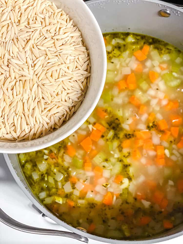 process shot showing adding orzo to pot