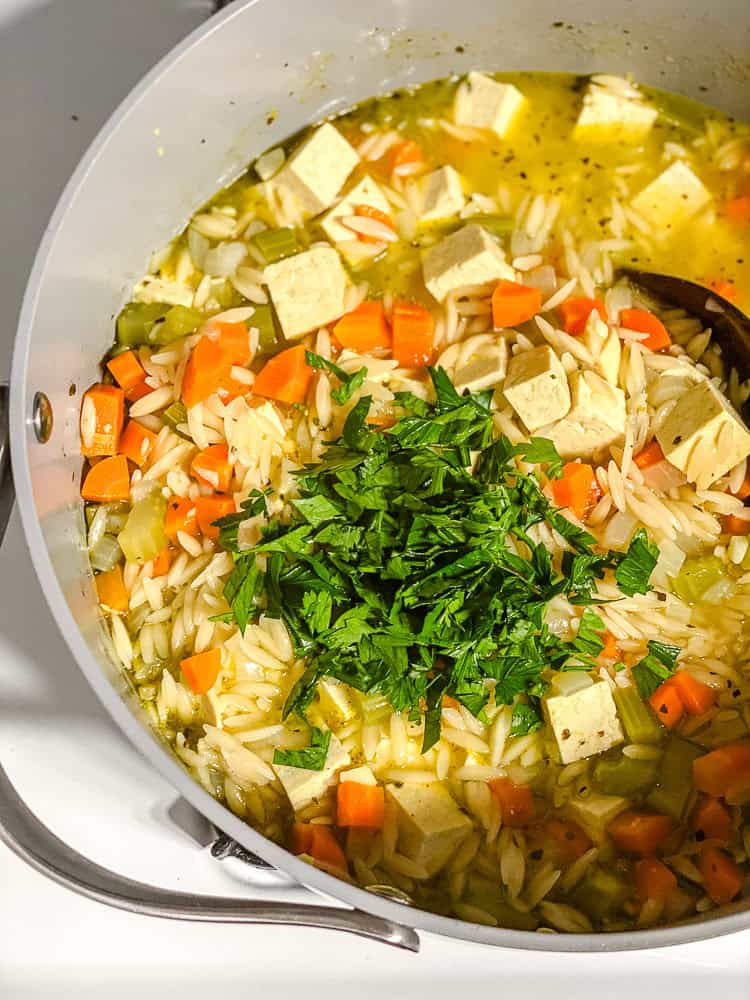 process shot showing soup cooking in pot