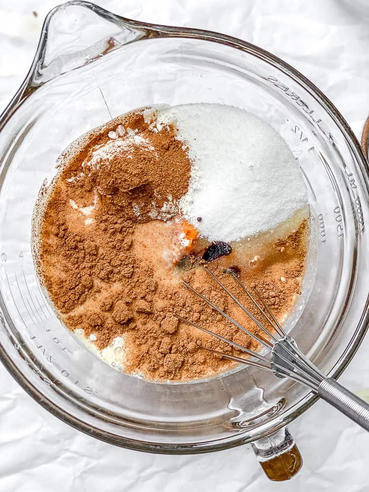 process shot of mixing ingredients together in a bowl