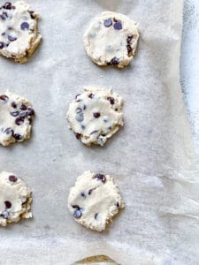 pre-baked Vegan Soft Chocolate Chip Cookies on a baking sheet