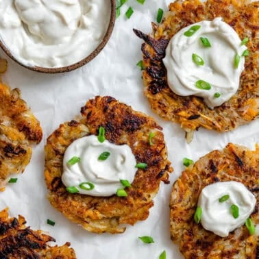 several completed Sweet Potato Latkes on a white surface