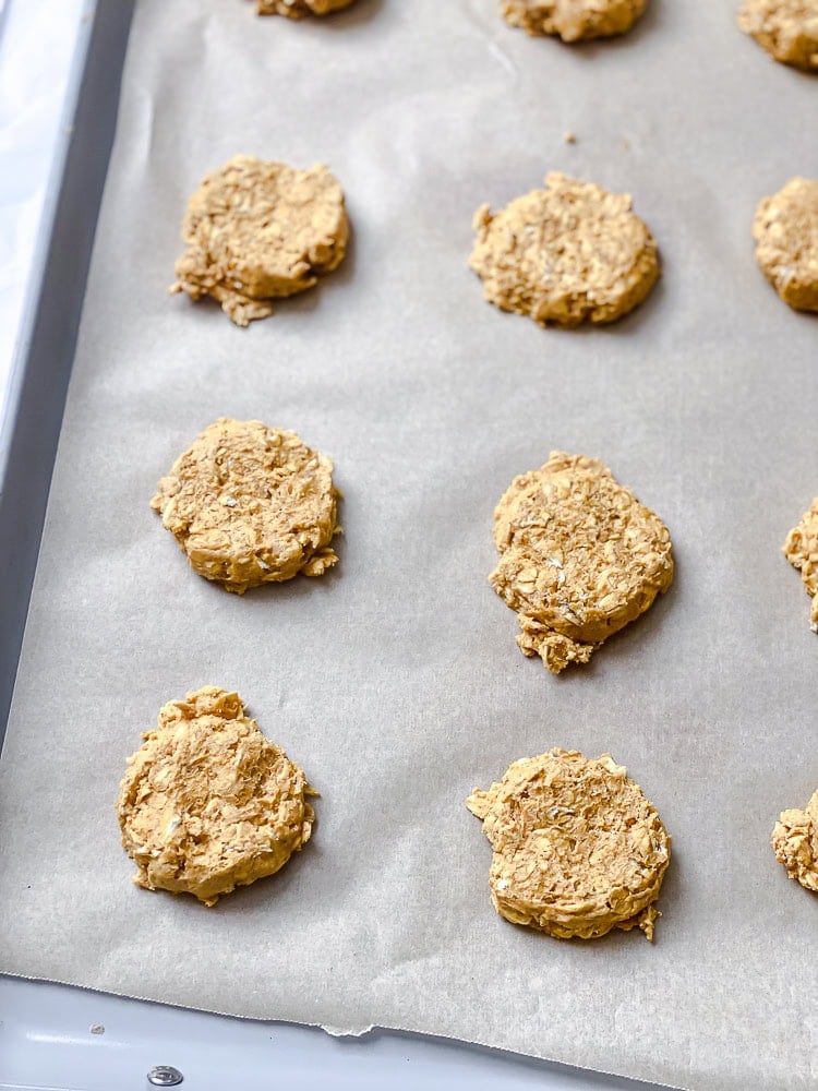 process shot showing pre-baked cookies on baking sheet