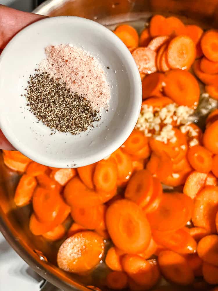 process shot of adding salt and pepper to pan