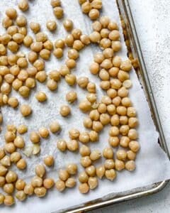 process shot showing chickpeas on baking tray