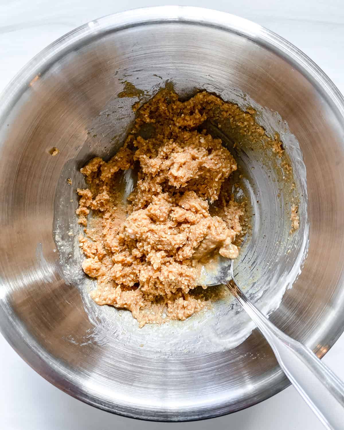 process shot showing mixing ingredients together in bowl