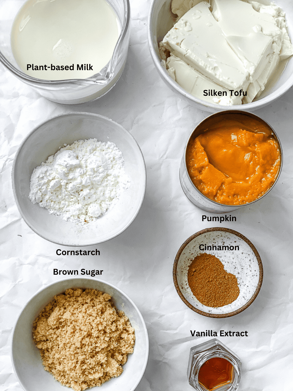 ingredients for Easy Pumpkin Pudding measured out on a white surface