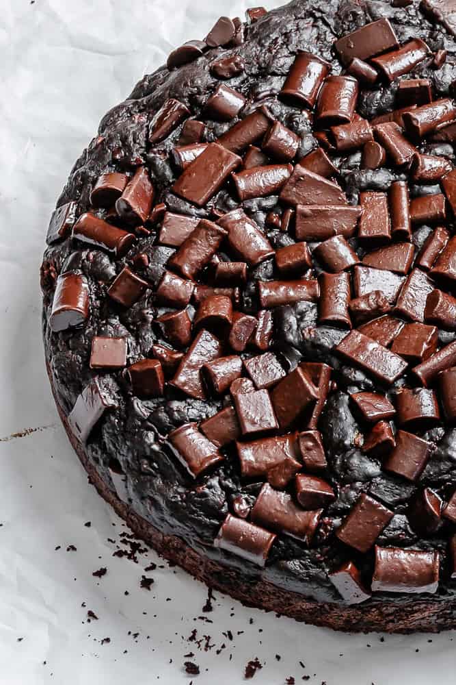 completed Chocolate Zucchini Cake on a white surface