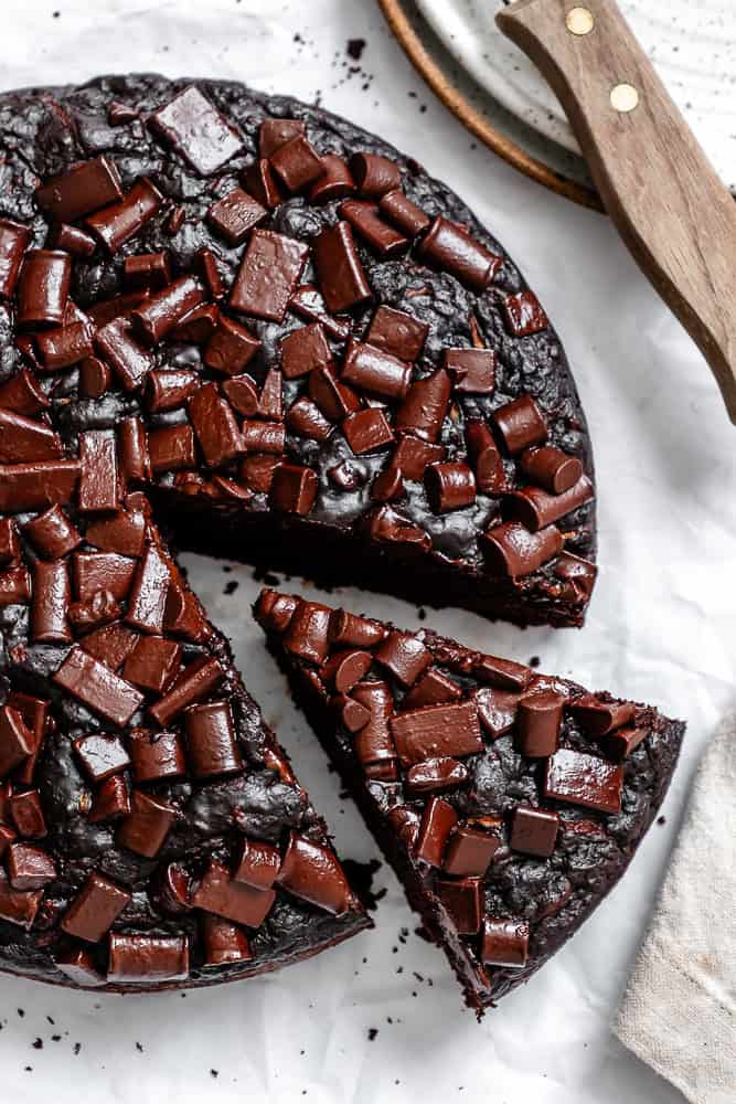 completed Chocolate Zucchini Cake on a white surface