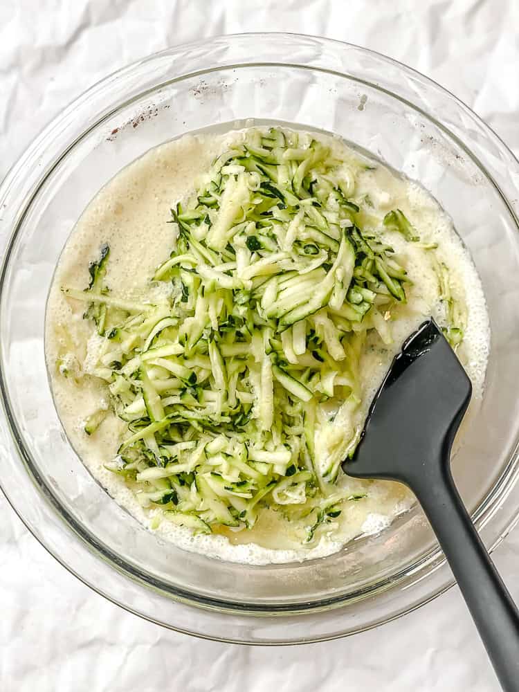 process shot showing mixing ingredients together in a bowl