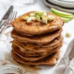 completed stack of Apple Cinnamon Pancakes on a white surface