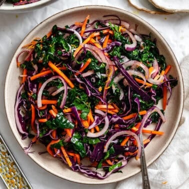 completed Crunchy Kale Slaw on a white surface